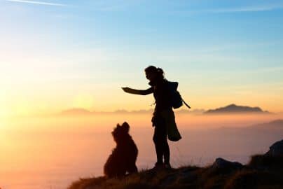 Girl plays with his dog